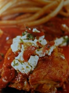 Chicken in tomato sauce with bucatini pasta