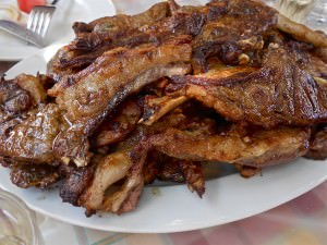 Mediterranean style bbq meal – grilled lamb chops, greek salad, feta cheese and tzatziki sauce
